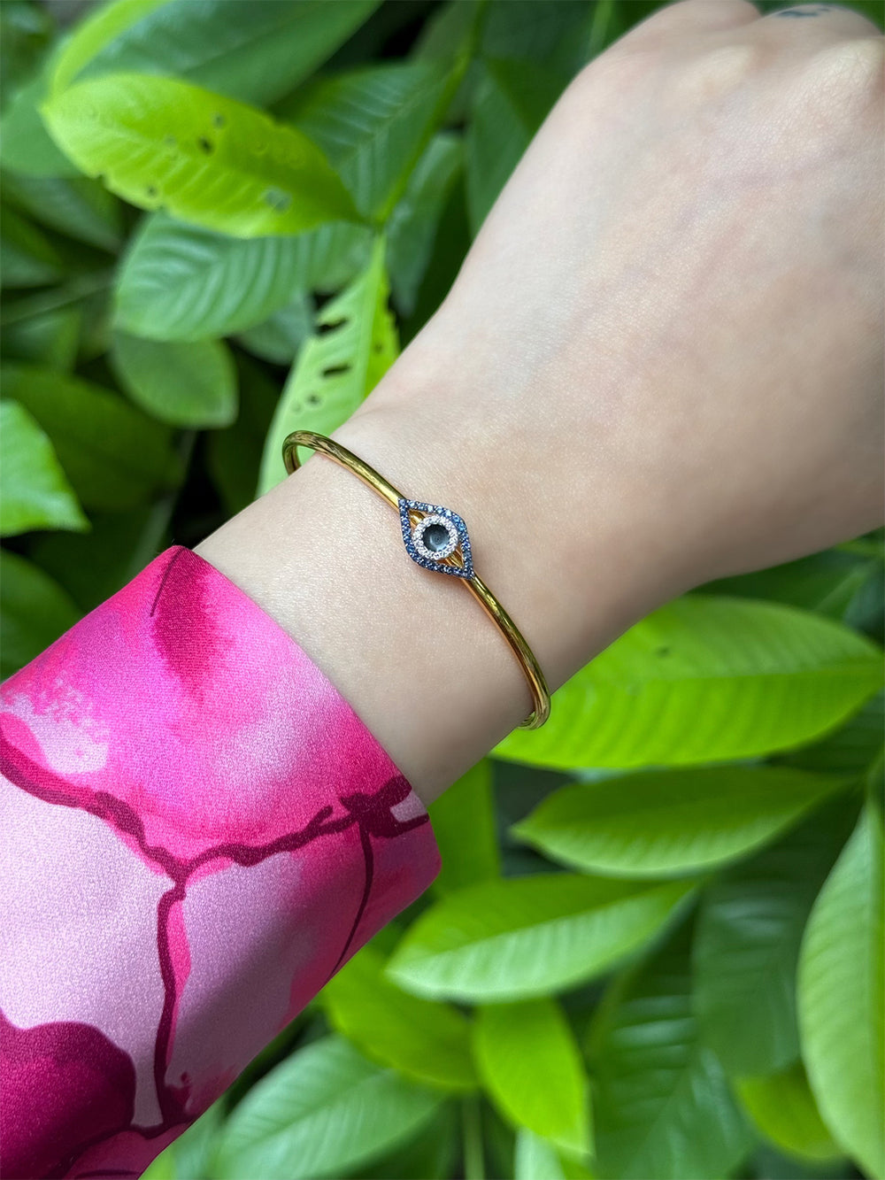 Bombay evil eye slide bangle with an adjustable fit, ideal for women seeking stylish protective jewelry