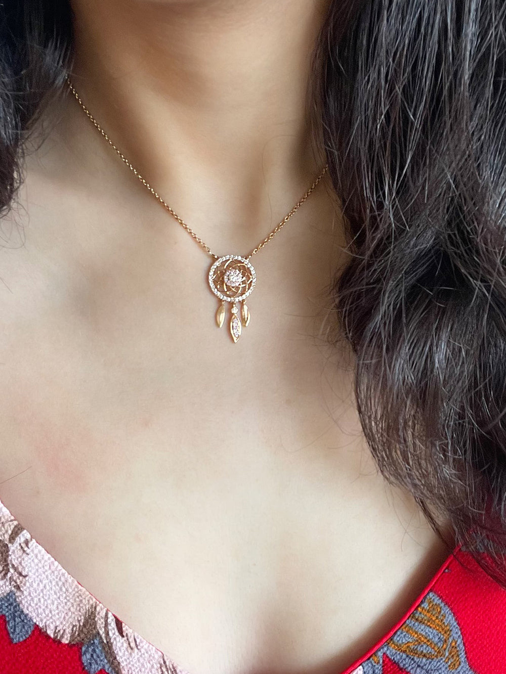 Blush dream catcher necklace with intricate detailing, designed as a symbol of positivity and style.
